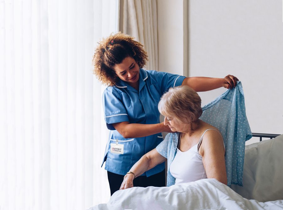A caregiver helping a client start the day comfortably
